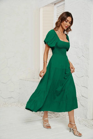 Klänning med smock i midjan