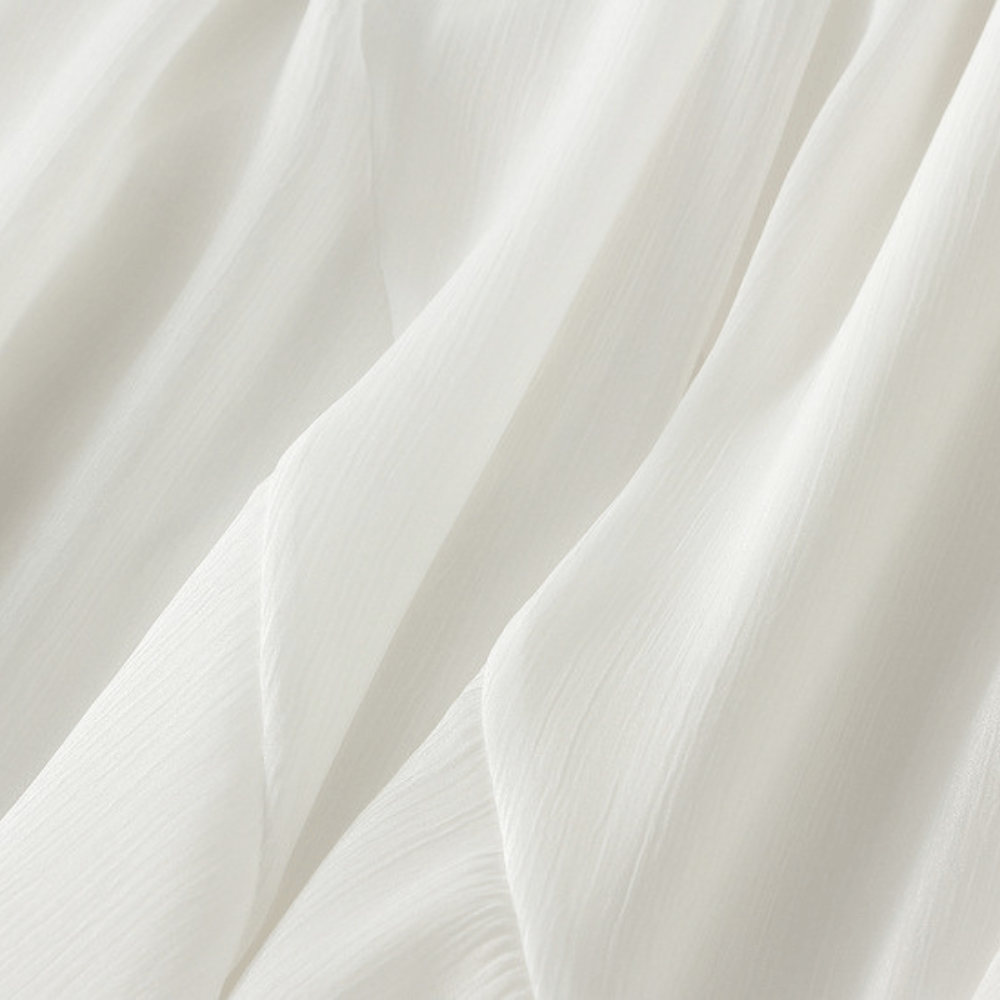 Midikjol med asymmetrisk drapering