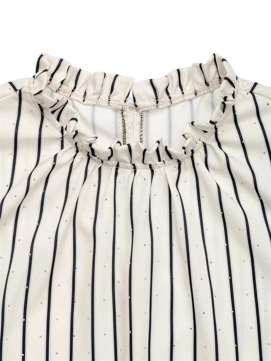 Randig blus med volang